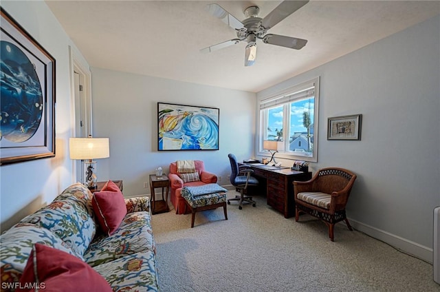 office space with baseboards, ceiling fan, and carpet flooring