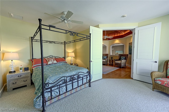 bedroom with light colored carpet and ceiling fan