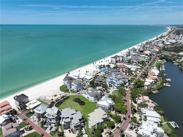 aerial view with a water view and a view of the beach