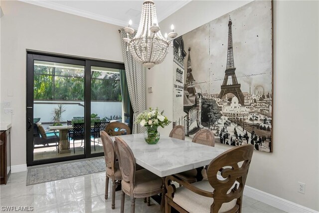 dining area featuring crown molding and a notable chandelier