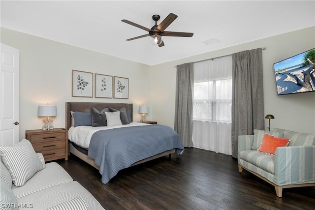 bedroom featuring ceiling fan and dark hardwood / wood-style floors