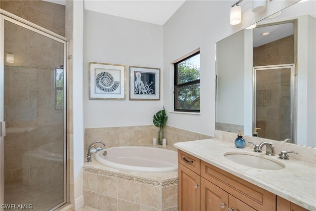 bathroom with separate shower and tub and vanity