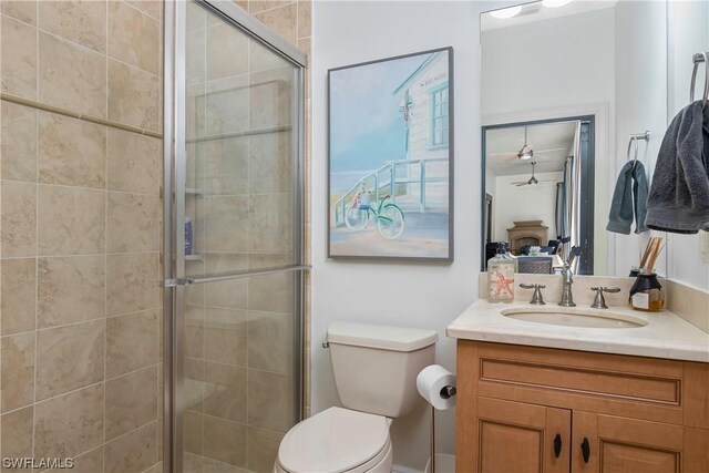 bathroom with vanity, toilet, and walk in shower