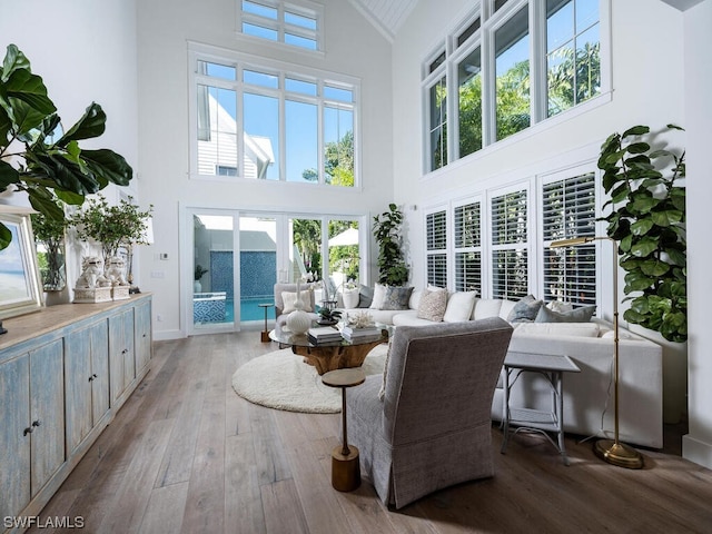 sunroom / solarium featuring french doors