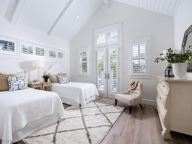 bedroom with access to exterior, high vaulted ceiling, light hardwood / wood-style flooring, beam ceiling, and french doors