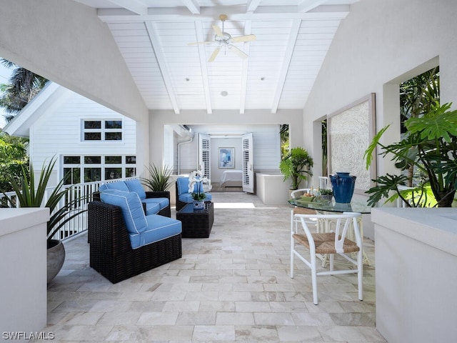 tiled living room with a healthy amount of sunlight, ceiling fan, high vaulted ceiling, and beam ceiling