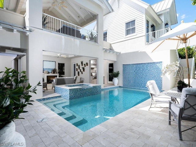 view of swimming pool featuring a patio, an in ground hot tub, and ceiling fan