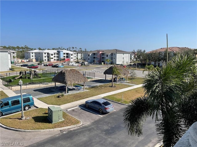 exterior space with a residential view and curbs