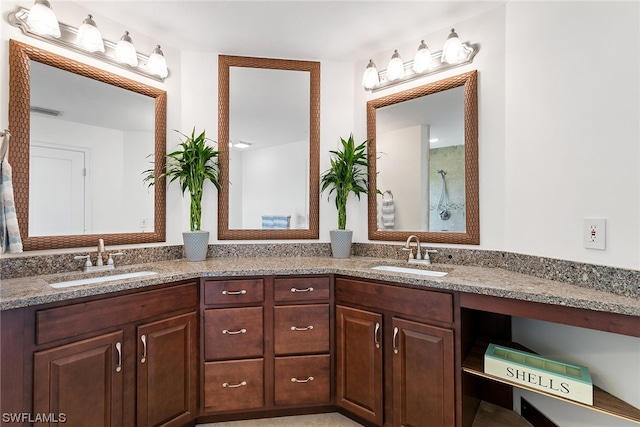 bathroom with oversized vanity and double sink