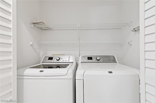 washroom featuring washing machine and dryer