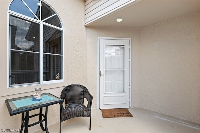 entrance to property featuring a patio area