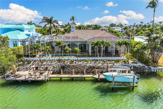 dock area with a water view and glass enclosure