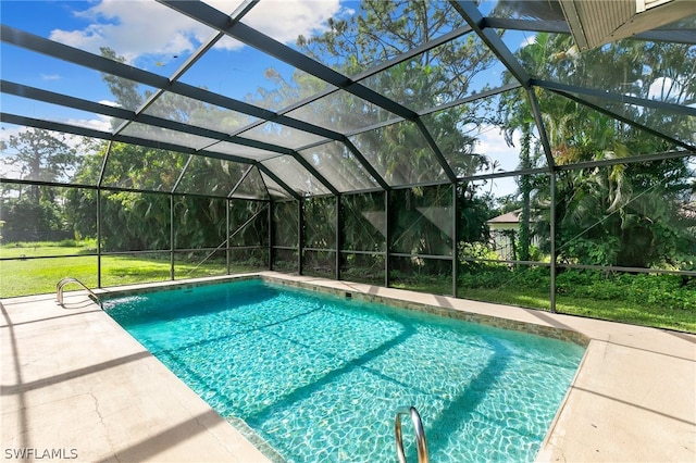 view of swimming pool with glass enclosure