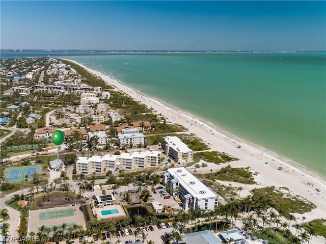 birds eye view of property featuring a view of the beach and a water view