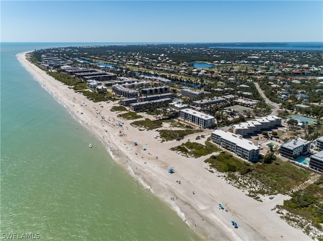 bird's eye view with a beach view and a water view