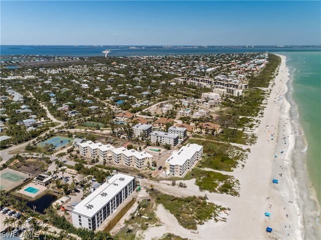 aerial view with a water view and a view of the beach