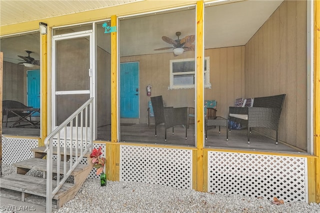 entrance to property featuring ceiling fan