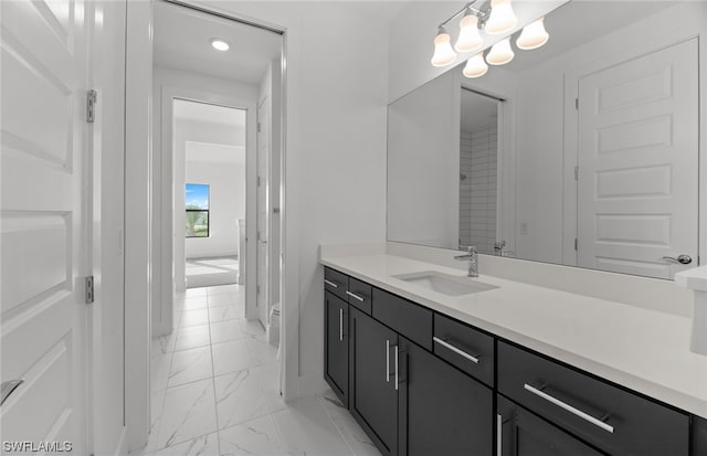 bathroom featuring vanity with extensive cabinet space and tile flooring