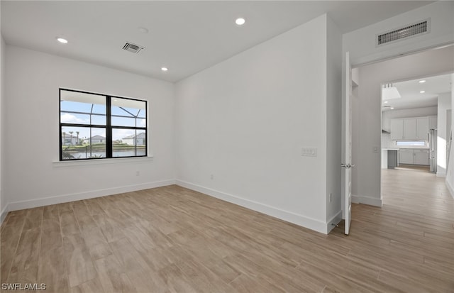 empty room with light wood-type flooring