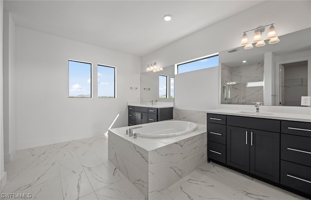 bathroom featuring tile flooring, dual sinks, tiled tub, and large vanity