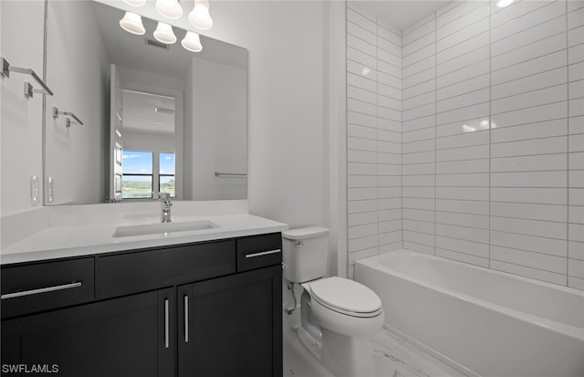 full bathroom featuring tiled shower / bath combo, toilet, and vanity