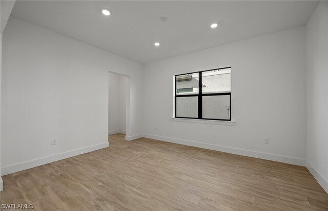 unfurnished room featuring light wood-type flooring