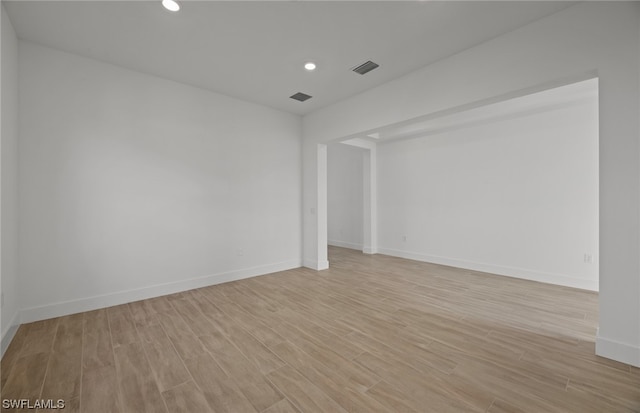 unfurnished room featuring light hardwood / wood-style floors