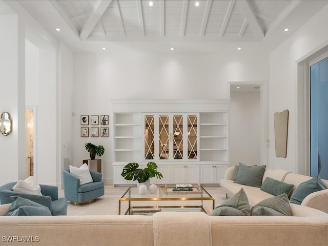 living room with beamed ceiling, hardwood / wood-style flooring, high vaulted ceiling, and wood ceiling