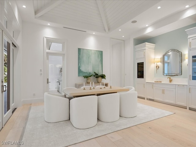 living room with beam ceiling, light wood-type flooring, and wooden ceiling