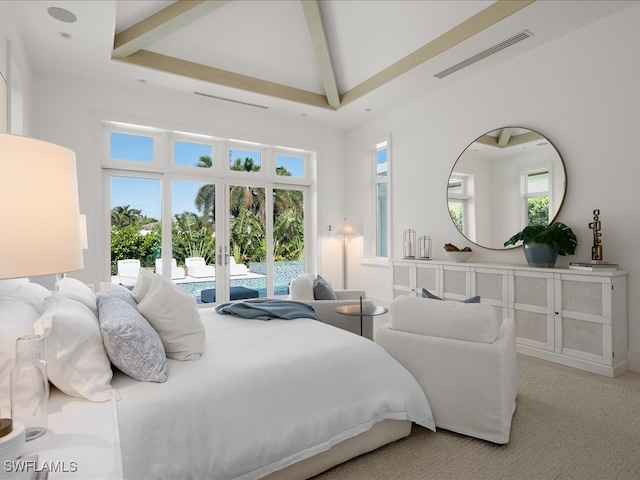 bedroom featuring beam ceiling, french doors, a tray ceiling, light colored carpet, and access to outside