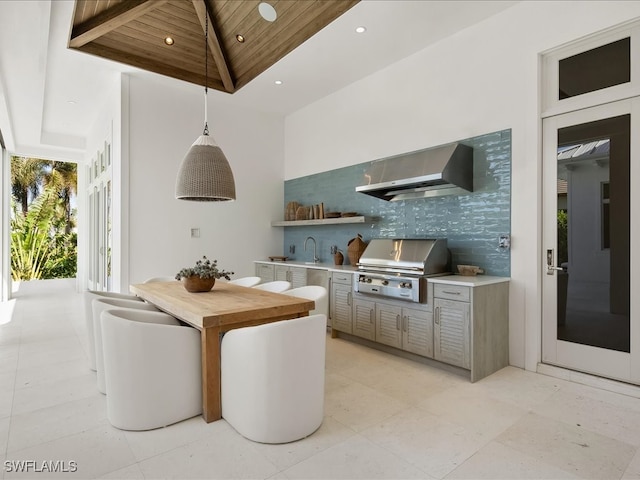 view of patio featuring grilling area, sink, and exterior kitchen