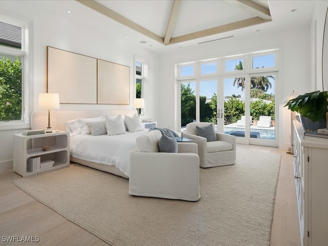 bedroom with french doors, a high ceiling, beamed ceiling, access to outside, and light wood-type flooring