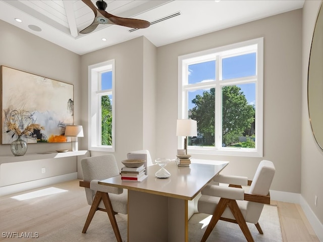 dining space with ceiling fan, light hardwood / wood-style flooring, and a healthy amount of sunlight