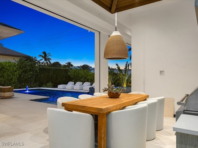 view of patio with a fenced in pool and pool water feature