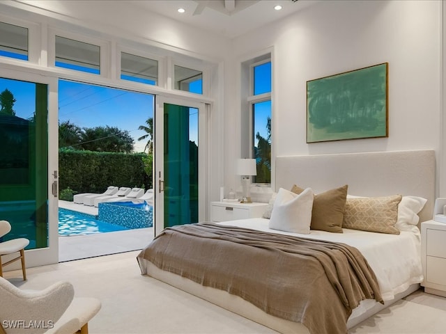 bedroom featuring access to exterior, ceiling fan, and multiple windows