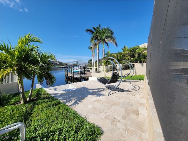 exterior space featuring a boat dock and a water view