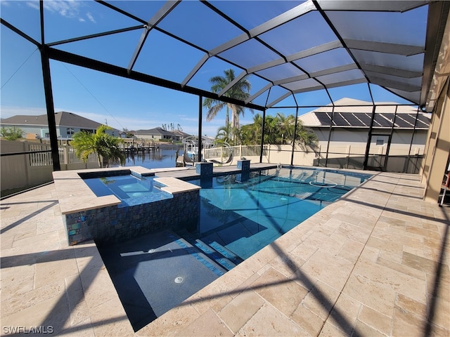 view of swimming pool featuring a lanai, a water view, an in ground hot tub, and a patio