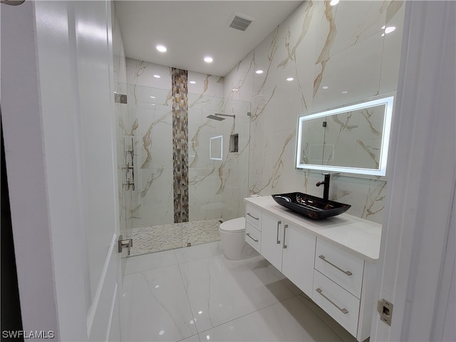 bathroom featuring vanity, toilet, and a shower with shower door