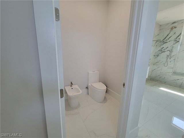 bathroom with a bidet, toilet, and a tile shower