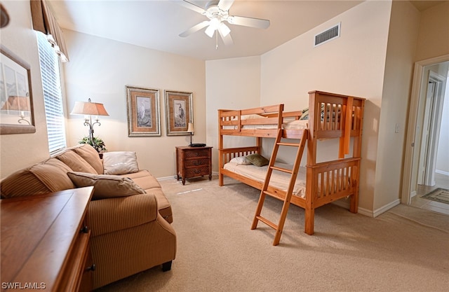 bedroom with light carpet and ceiling fan