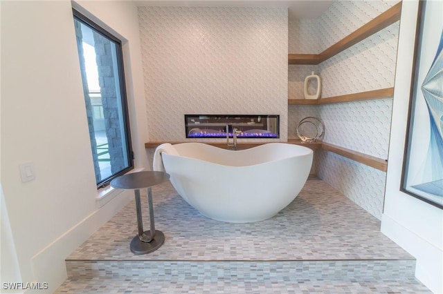 bathroom with a tub to relax in
