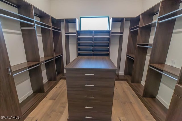 spacious closet with light hardwood / wood-style floors