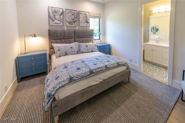 bedroom with sink and ensuite bathroom