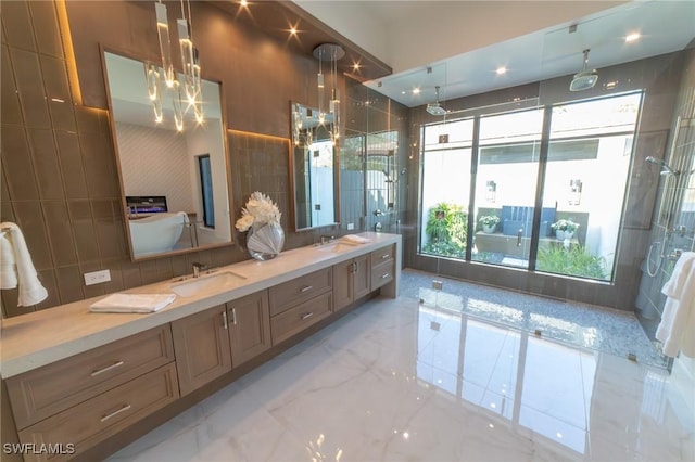 bathroom featuring vanity, a chandelier, tile walls, and a shower