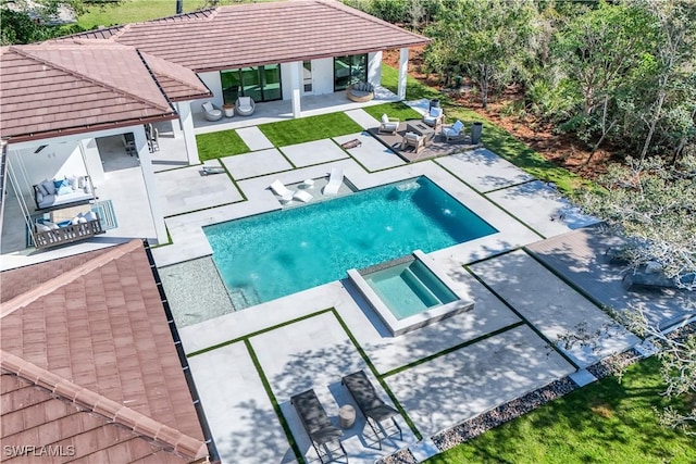 view of pool with an in ground hot tub, a gazebo, and a patio