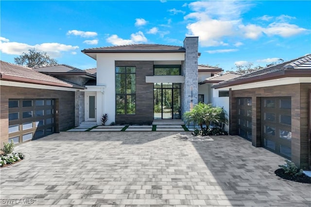 back of property with a garage