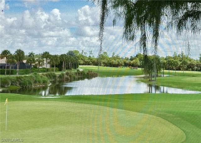 view of community with a lawn and a water view