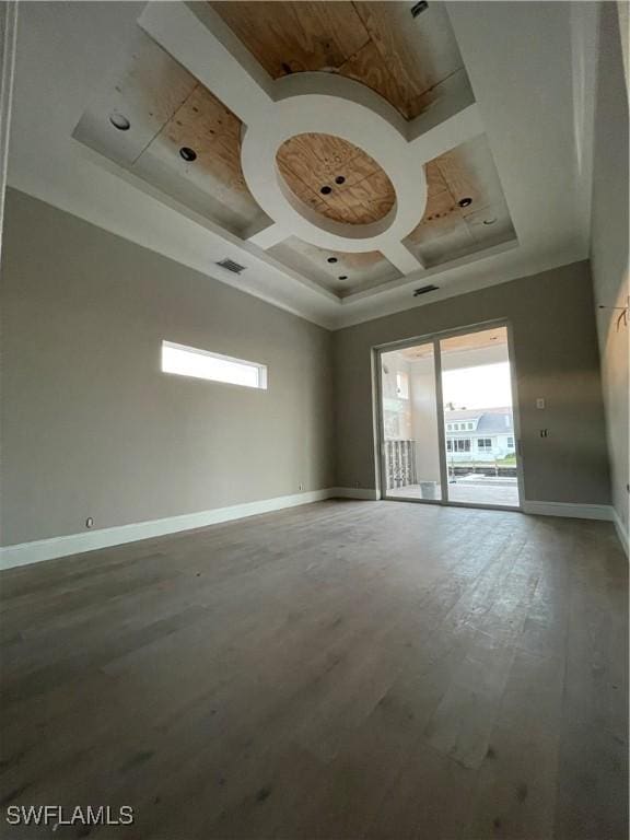 spare room featuring a high ceiling and coffered ceiling