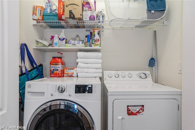 laundry room featuring washer and clothes dryer