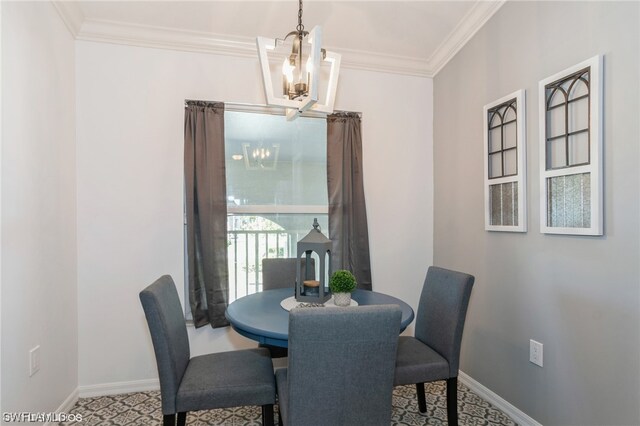 dining area with crown molding and an inviting chandelier